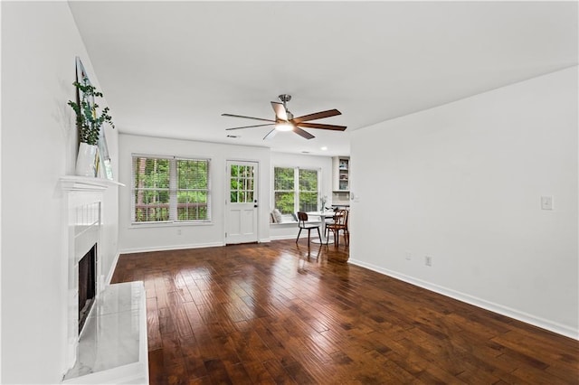 1320 Country Acres Ln, Lawrenceville, GA 30045 - unfurnished living room featuring ceiling fan, hardwood / wood-style flooring, and a high end fireplace