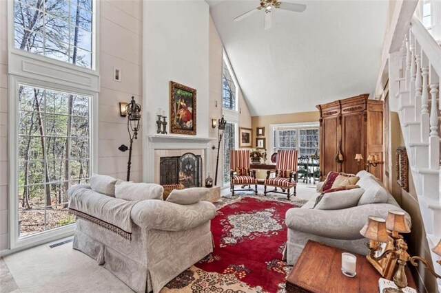 sunroom / solarium featuring lofted ceiling and ceiling fan