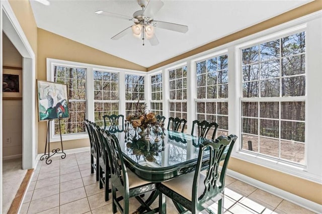 sunroom / solarium featuring lofted ceiling and ceiling fan