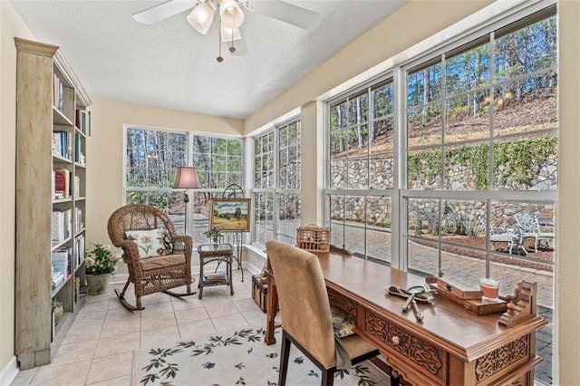 sunroom / solarium with ceiling fan