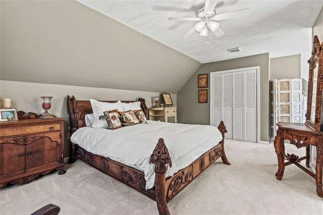 carpeted bedroom with a ceiling fan, lofted ceiling, a textured ceiling, and baseboards