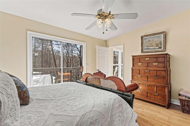 bedroom featuring light wood-style floors, access to exterior, baseboards, and a ceiling fan