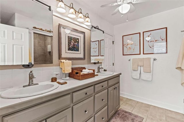 full bathroom with double vanity, tile patterned flooring, decorative backsplash, and a sink