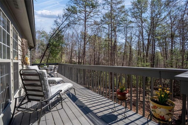 deck with outdoor dining area