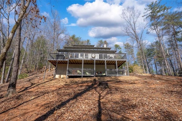 rear view of house featuring a deck