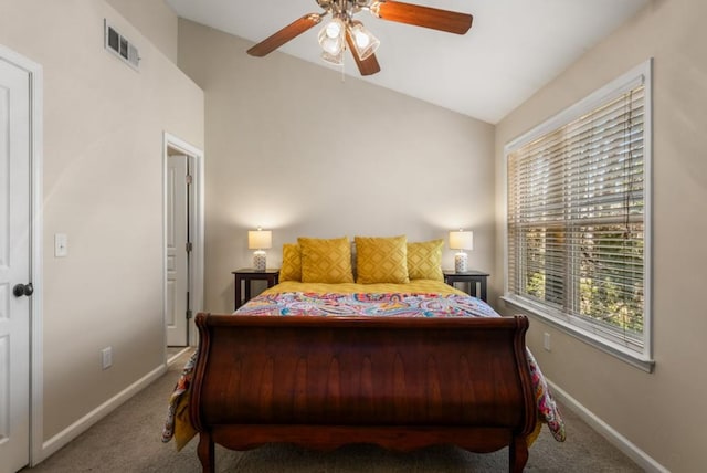 bedroom with carpet, visible vents, vaulted ceiling, and baseboards