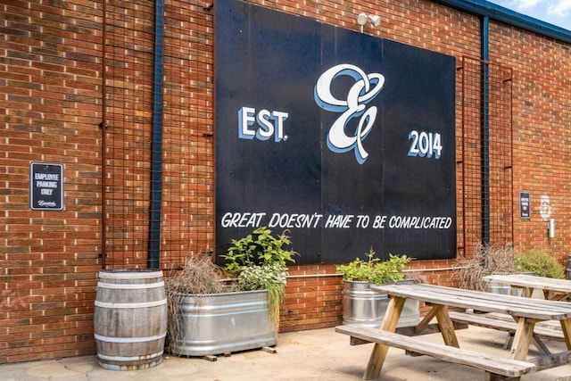 exterior space with brick siding