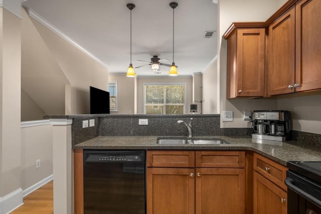 kitchen with brown cabinets, dishwasher, visible vents, and a sink