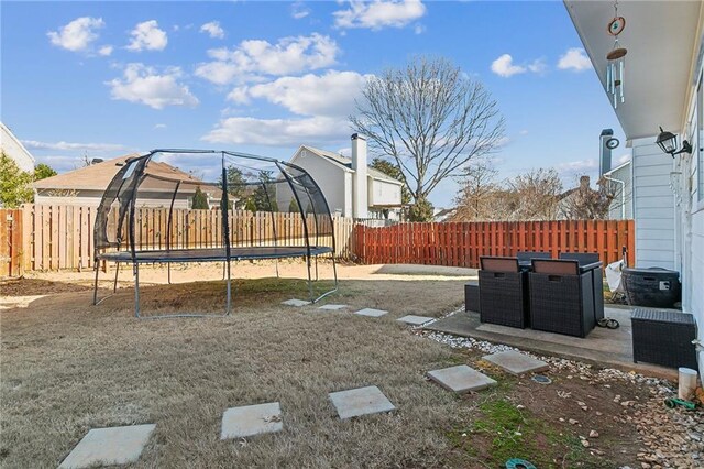 1240 Birchwood Ln, Roswell, GA 30076 - fenced backyard featuring a trampoline