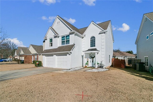 1240 Birchwood Ln, Roswell, GA 30076 - traditional-style house featuring a garage, concrete driveway, central air condition unit, and a shingled roof