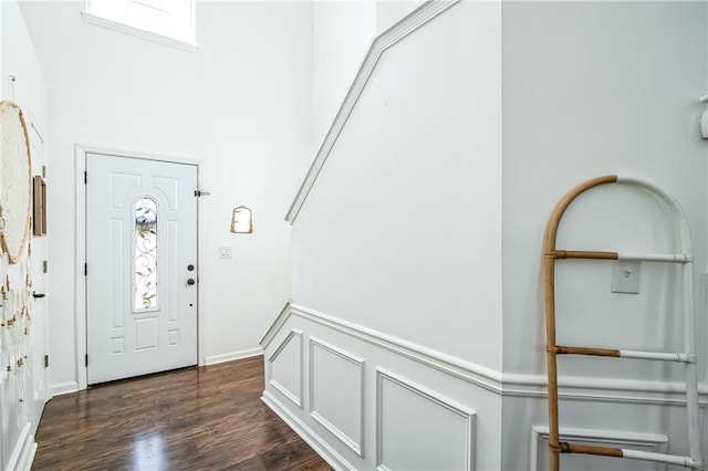 1240 Birchwood Ln, Roswell, GA 30076 - entrance foyer with plenty of natural light, dark wood finished floors, a high ceiling, and wainscoting