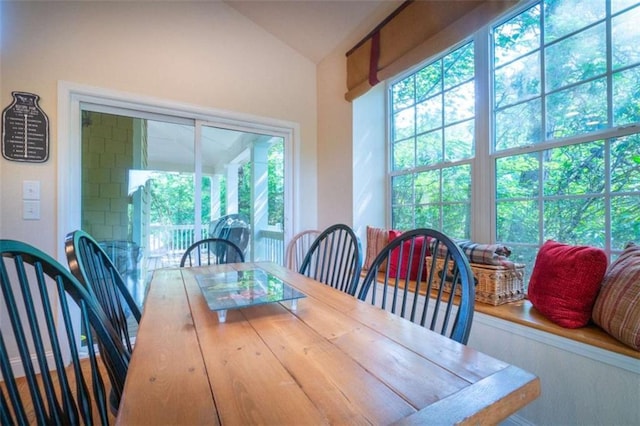 dining space with vaulted ceiling