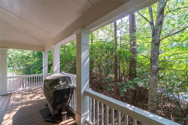 wooden deck with a grill