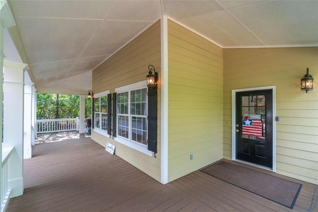 wooden deck featuring covered porch