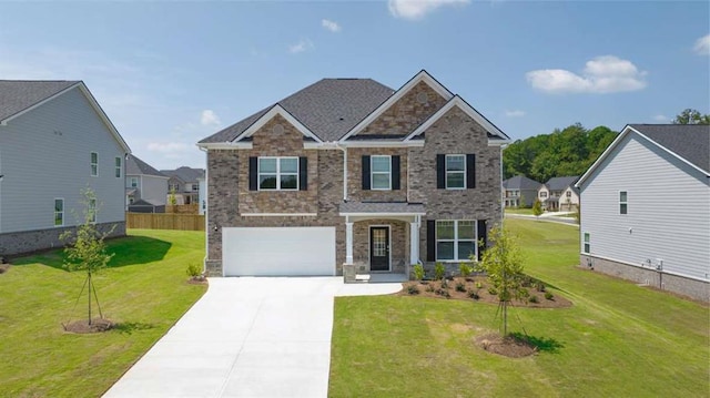 craftsman-style house with a front yard, concrete driveway, and brick siding