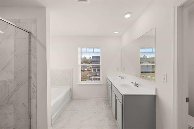 full bathroom featuring a sink, baseboards, marble finish floor, a marble finish shower, and a bath