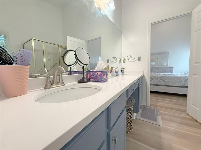 260 Ruby Forest Pkwy, Suwanee, GA 30024 - bathroom featuring ensuite bathroom, wood finished floors, double vanity, and a stall shower