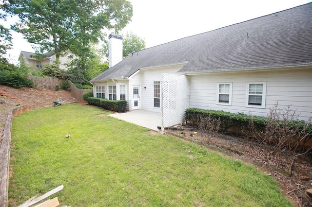 260 Ruby Forest Pkwy, Suwanee, GA 30024 - back of house featuring a chimney, a patio, and roof with shingles