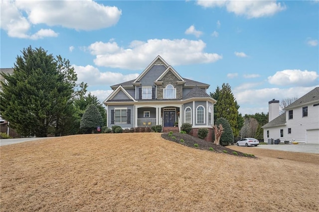 view of front of house featuring a front lawn and a porch