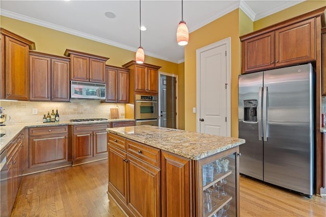 kitchen featuring crown molding, light stone countertops, brown cabinets, light wood-type flooring, and stainless steel appliances