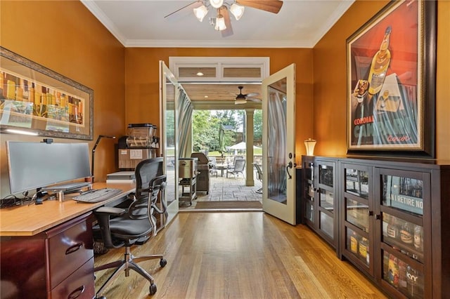 office space with crown molding, ceiling fan, french doors, and wood finished floors