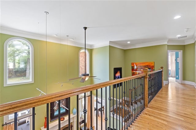 corridor with recessed lighting, baseboards, crown molding, and wood finished floors