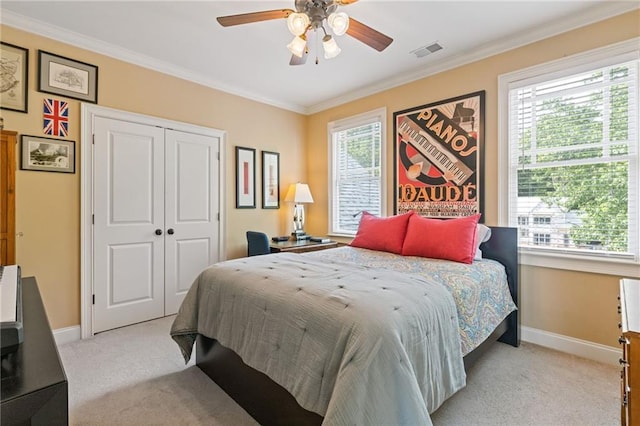 bedroom featuring baseboards, ornamental molding, light carpet, and visible vents