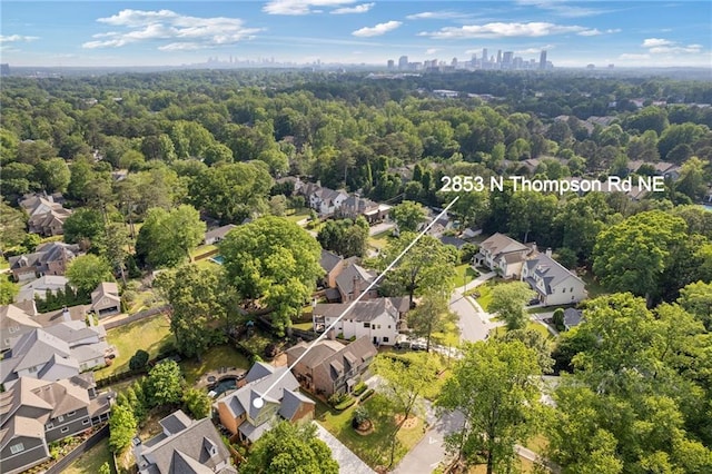 aerial view featuring a view of trees and a residential view