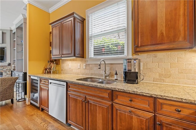 kitchen with crown molding, beverage cooler, light stone counters, a sink, and dishwasher