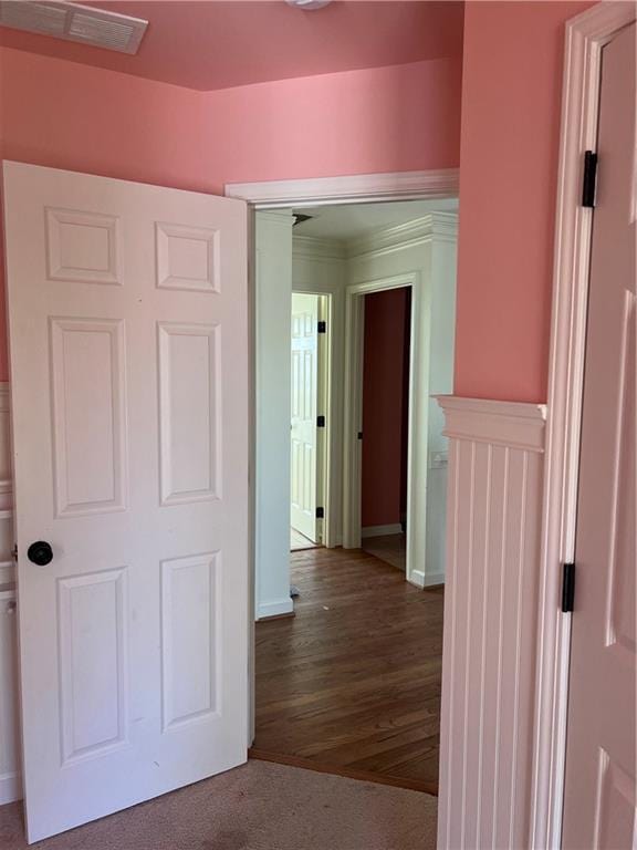 corridor with wood-type flooring