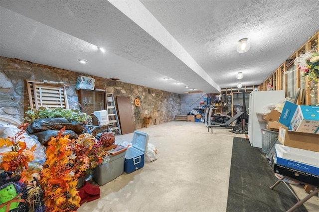 basement featuring a textured ceiling