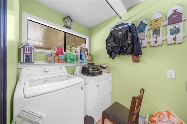 clothes washing area with washing machine and clothes dryer