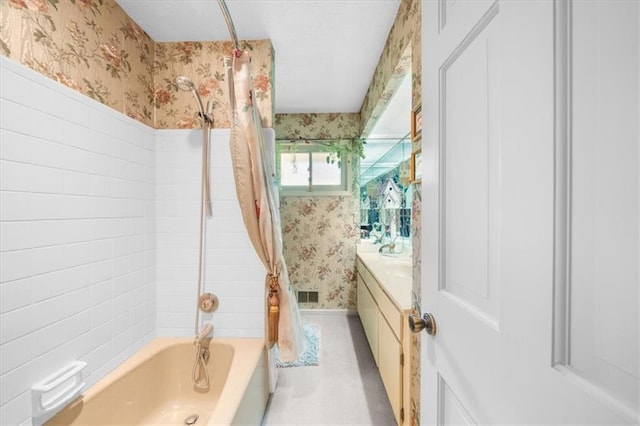 bathroom featuring vanity and shower / bath combo with shower curtain