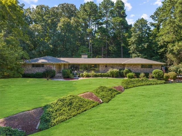 ranch-style home with a front yard