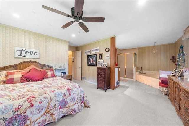 bedroom with light colored carpet and ceiling fan with notable chandelier