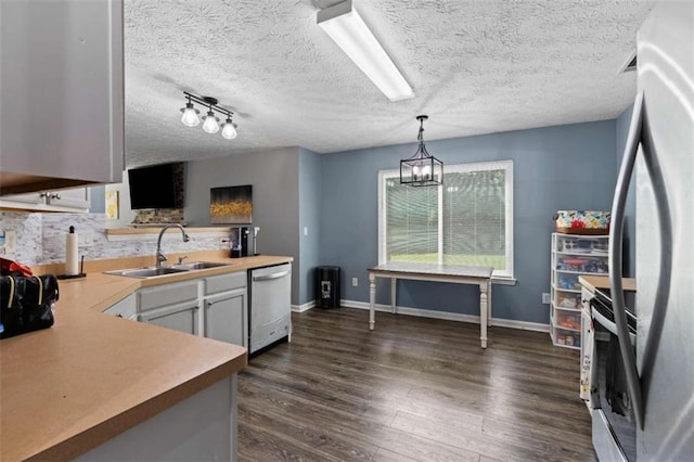 220 Brookstone Trl, Braselton, GA 30517 - kitchen with appliances with stainless steel finishes, dark wood-type flooring, light countertops, tasteful backsplash, and a textured ceiling