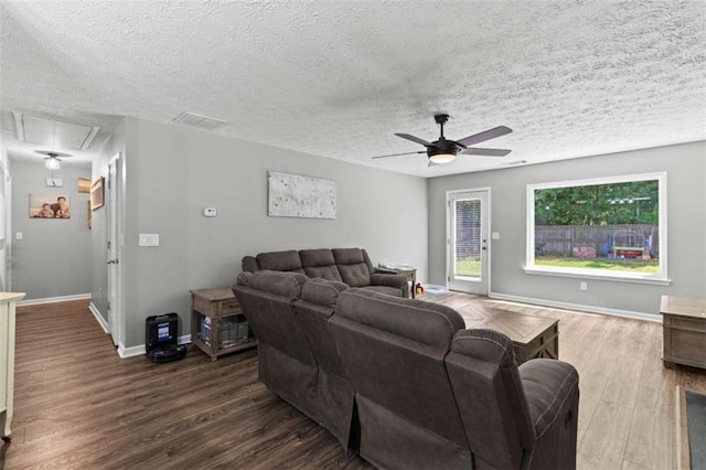 220 Brookstone Trl, Braselton, GA 30517 - living area with attic access, a ceiling fan, dark wood-type flooring, and a textured ceiling