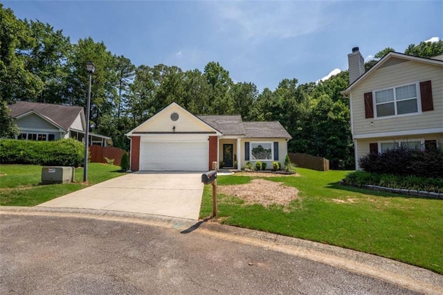 220 Brookstone Trl, Braselton, GA 30517 - view of front of house featuring driveway, an attached garage, and a chimney