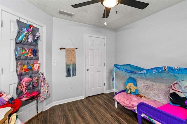220 Brookstone Trl, Braselton, GA 30517 - bedroom with wood finished floors, a textured ceiling, and a ceiling fan
