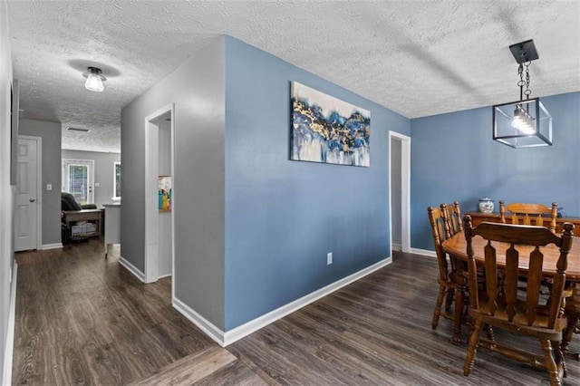 220 Brookstone Trl, Braselton, GA 30517 - dining space featuring a textured ceiling and dark wood-type flooring