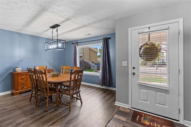220 Brookstone Trl, Braselton, GA 30517 - dining area with dark wood-style flooring and a textured ceiling