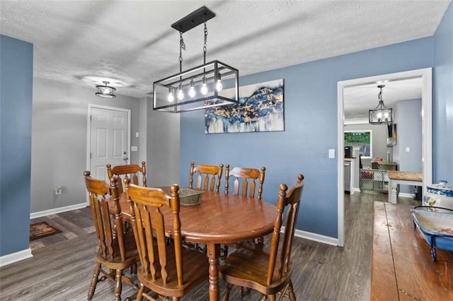 220 Brookstone Trl, Braselton, GA 30517 - dining space with a textured ceiling, wood finished floors, and a chandelier