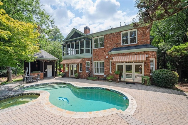 1006 Arbor Trce NE, Atlanta, GA 30319 - view of pool with french doors, a patio area, and a pool with connected hot tub