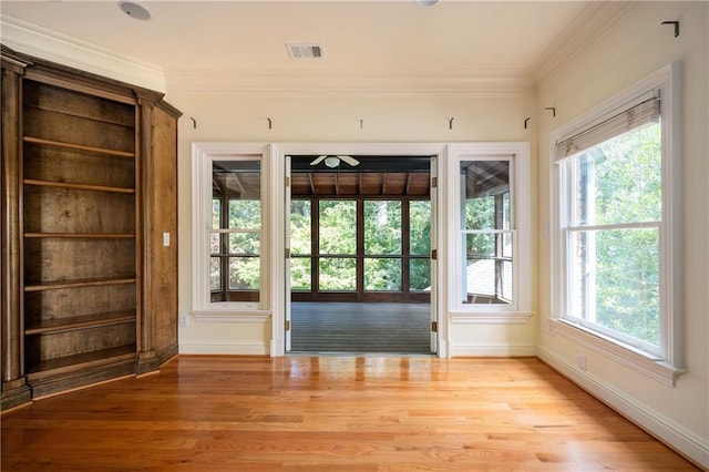 1006 Arbor Trce NE, Atlanta, GA 30319 - doorway to outside with light wood-style floors, a ceiling fan, and crown molding