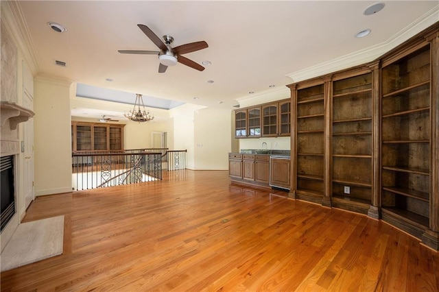 1006 Arbor Trce NE, Atlanta, GA 30319 - unfurnished living room with ceiling fan, crown molding, light wood-style flooring, a high end fireplace, and recessed lighting
