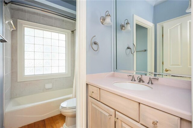 1006 Arbor Trce NE, Atlanta, GA 30319 - full bath featuring shower / bath combo with shower curtain, vanity, and wood finished floors