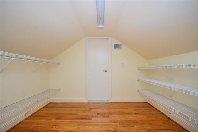 1006 Arbor Trce NE, Atlanta, GA 30319 - spacious closet featuring light wood finished floors and lofted ceiling