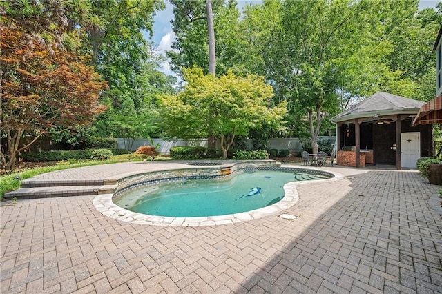 1006 Arbor Trce NE, Atlanta, GA 30319 - view of swimming pool featuring a patio, a fenced backyard, ceiling fan, and view of scattered trees
