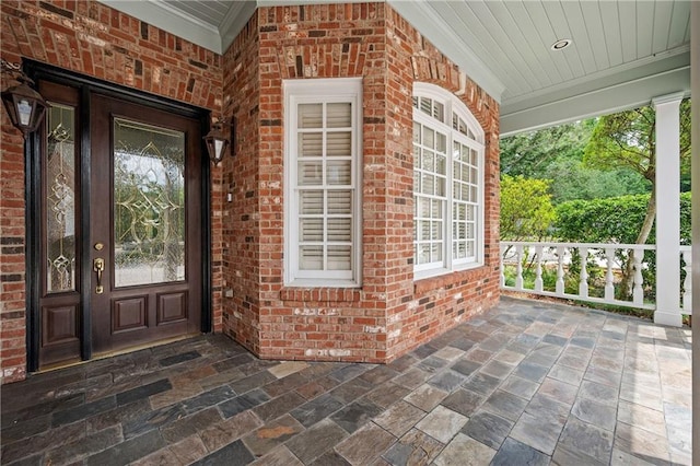 1006 Arbor Trce NE, Atlanta, GA 30319 - doorway to property featuring covered porch and brick siding