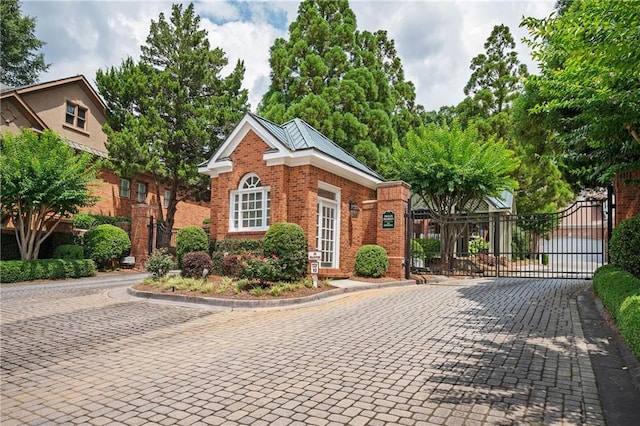 1006 Arbor Trce NE, Atlanta, GA 30319 - view of front of house with brick siding and a gate